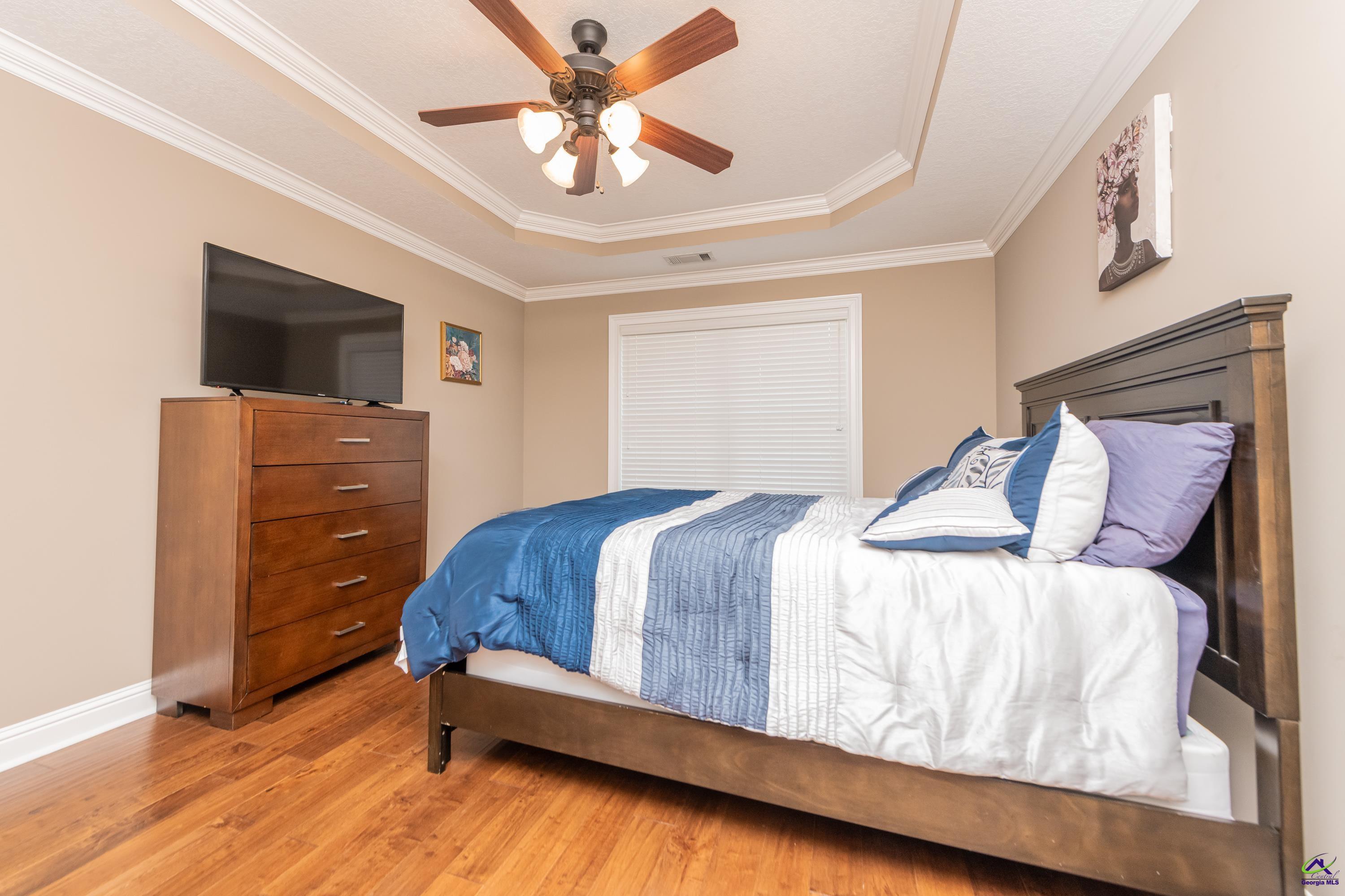 405 Old Bridge Road Warner Robins, GA 31088 - Photo 47 of 58 a bedroom with a bed and a dresser