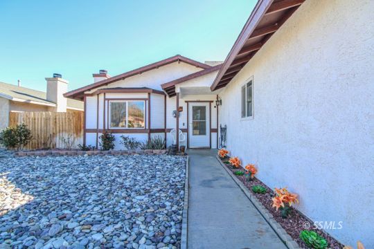 324 Sims Street Ridgecrest, CA 93555 - Photo 4 of 40 a front view of a house with a yard
