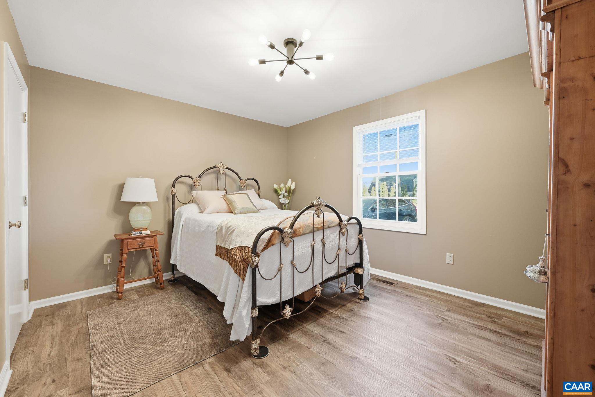 5356 Amicus Road Ruckersville, VA 22968 - Photo 4 of 46 a bed sitting in a bedroom next to a window
