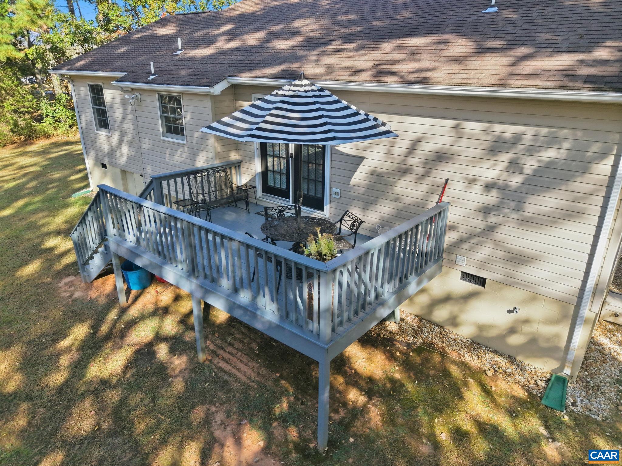 5356 Amicus Road Ruckersville, VA 22968 - Photo 41 of 46 a view of a roof deck with chair and wooden floor
