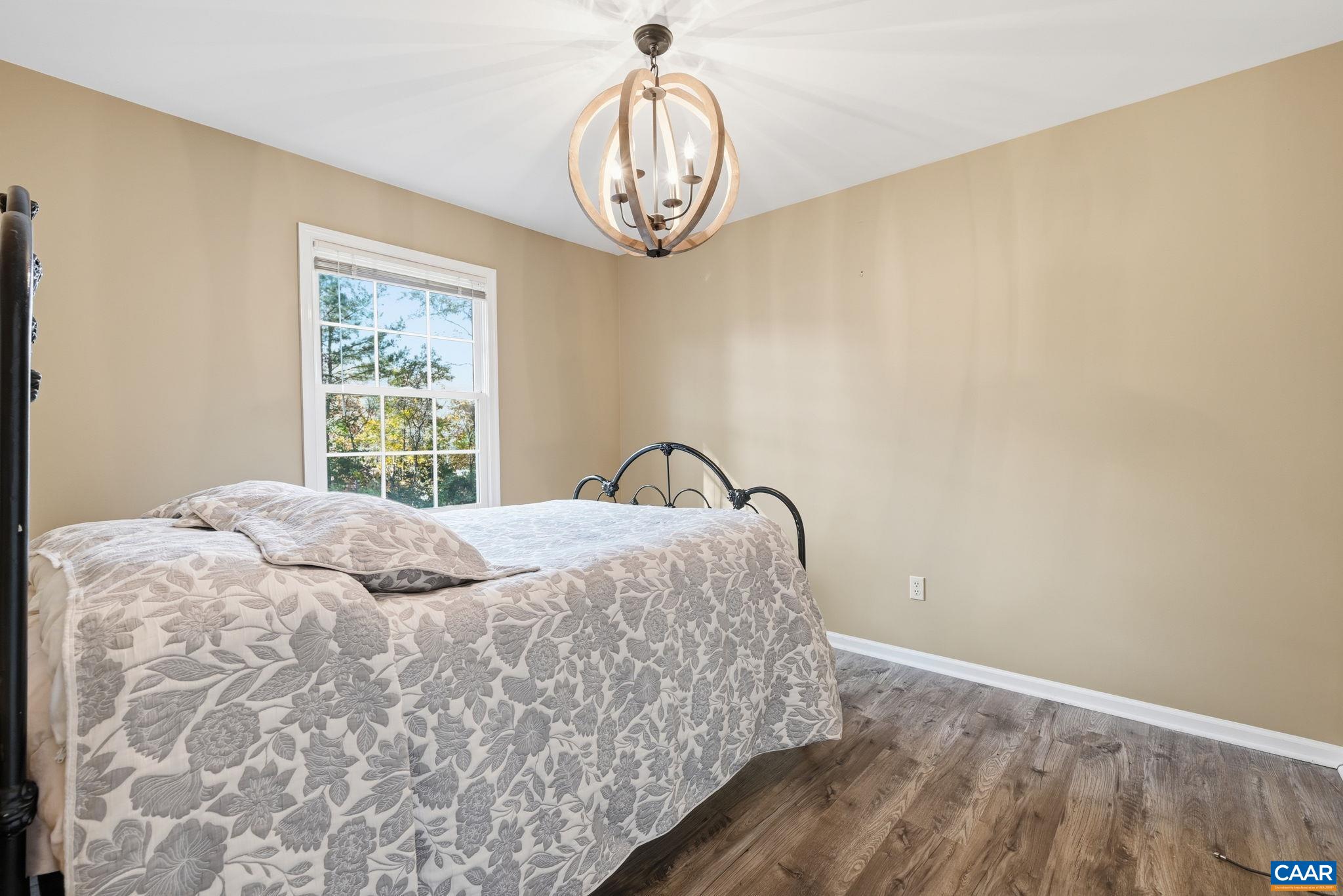 5356 Amicus Road Ruckersville, VA 22968 - Photo 6 of 46 a bedroom with a bed and a window
