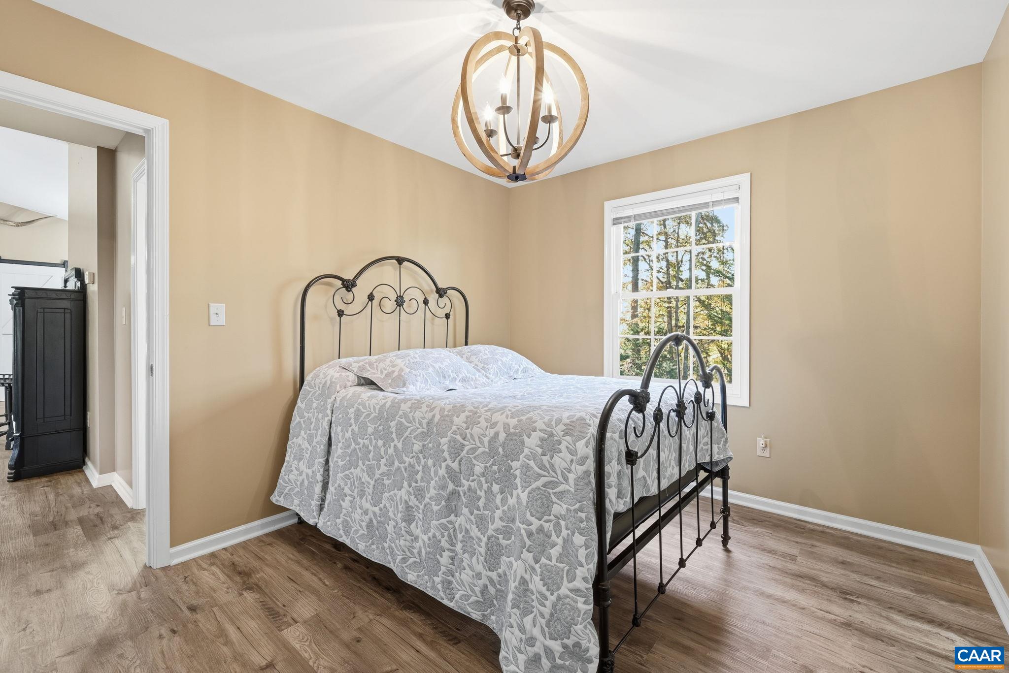 5356 Amicus Road Ruckersville, VA 22968 - Photo 7 of 46 a bedroom with a bed and a window