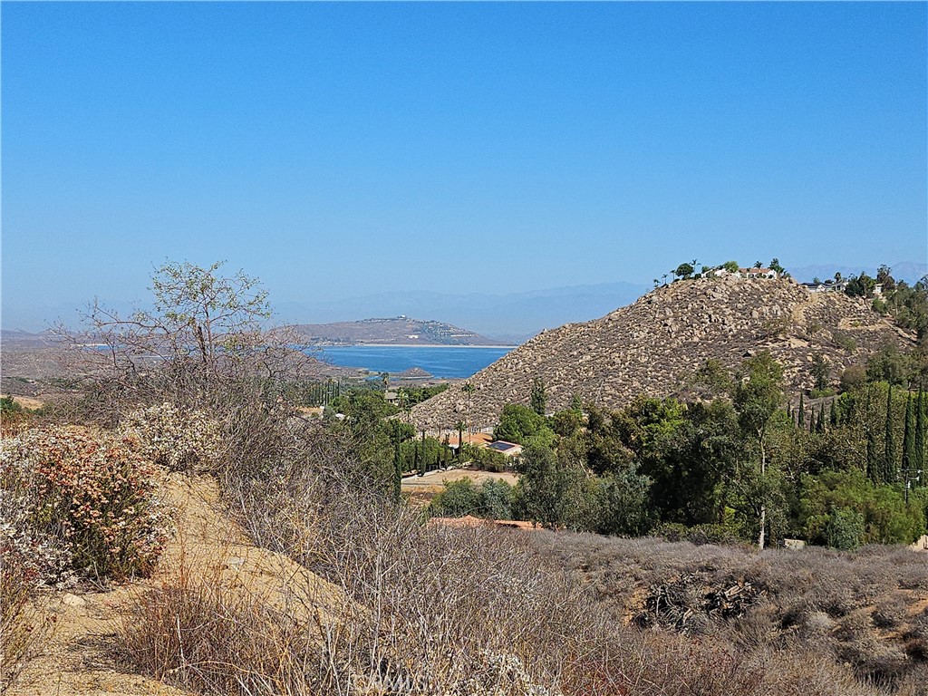 0 Malta Place Perris, CA 92570 - Photo 3 of 7 a view of a dry yard with mountains in the background