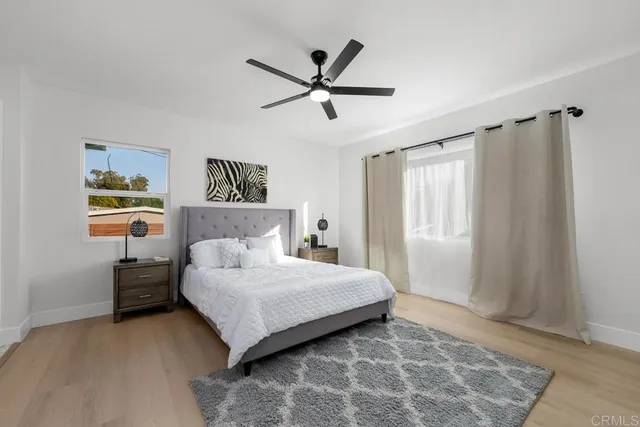 a bedroom with a bed and window