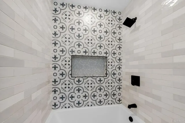 a bathroom with a bathtub and a shower