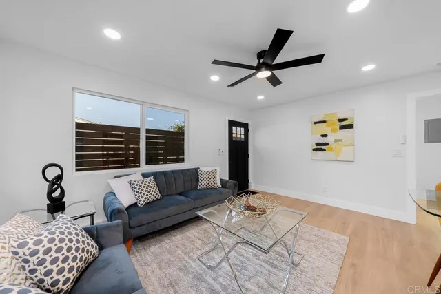 a living room with furniture and window