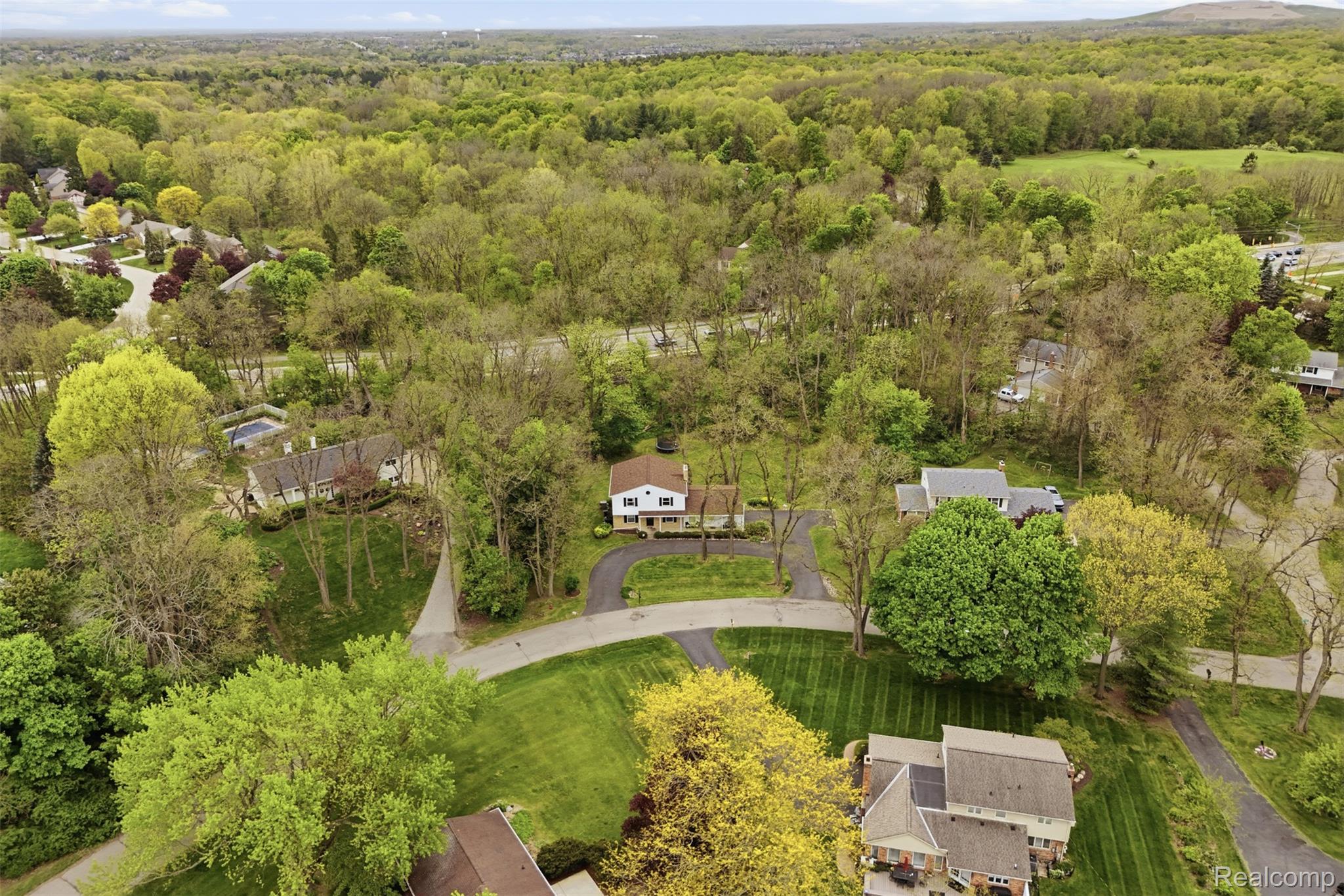 47129 Dunsany Road Northville, MI 48167 - Photo 44 of 49 Aerial view of residential area featuring a forest