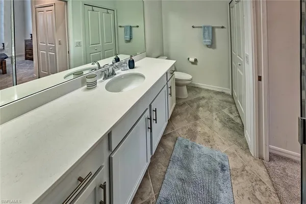 a bedroom with a bed and a cabinets