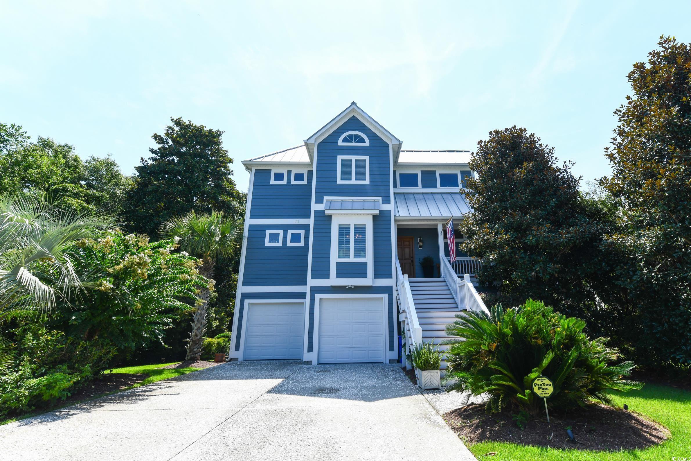 25 Orchard Avenue Murrells Inlet, SC 29576 - Photo 1 of 40 View of front facade with a garage