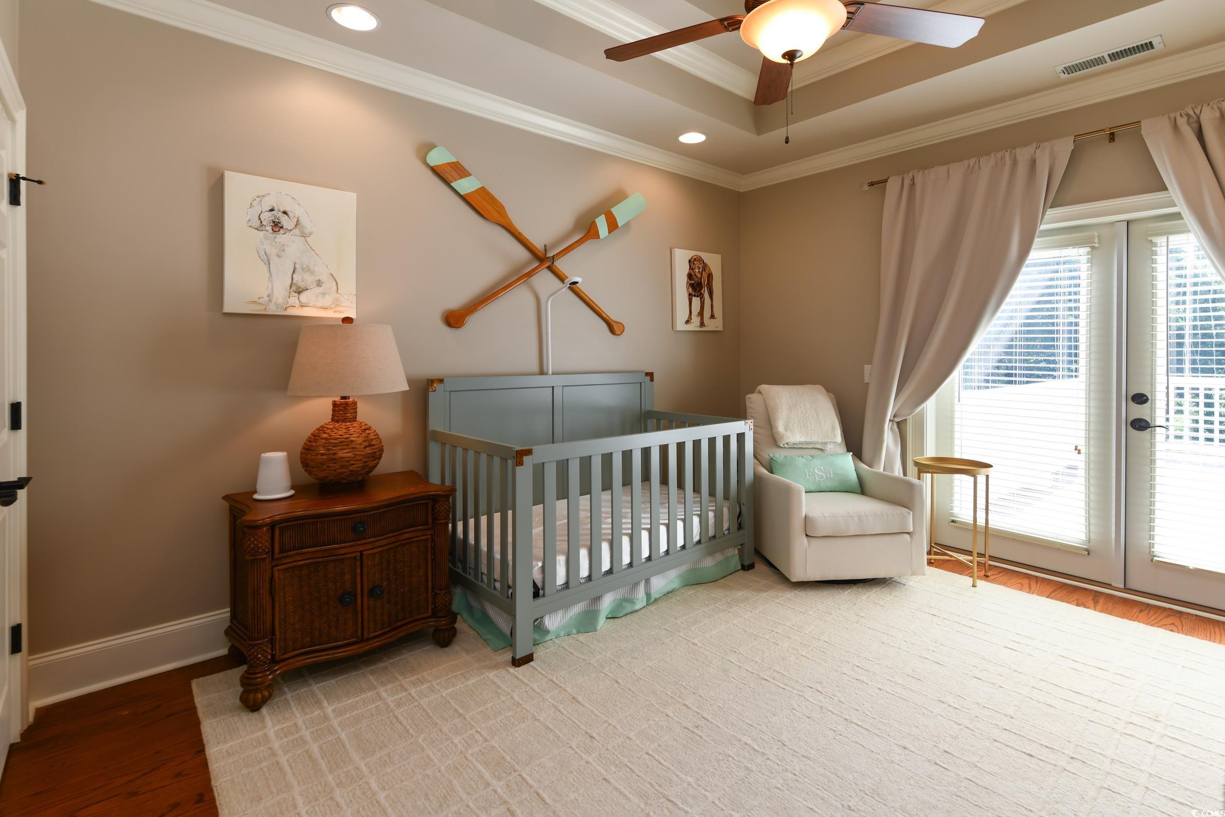 25 Orchard Avenue Murrells Inlet, SC 29576 - Photo 23 of 40 Bedroom featuring ceiling fan, access to outside,
