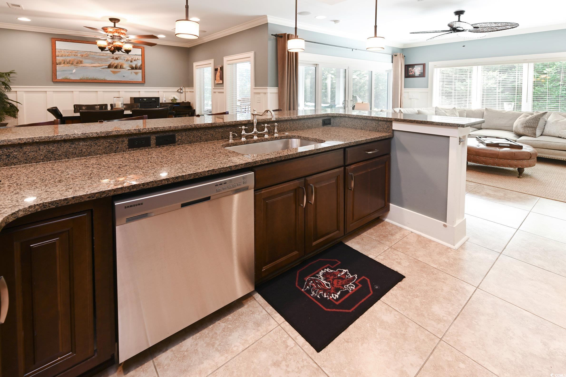 25 Orchard Avenue Murrells Inlet, SC 29576 - Photo 28 of 40 Kitchen with ceiling fan, dark stone counters, sin