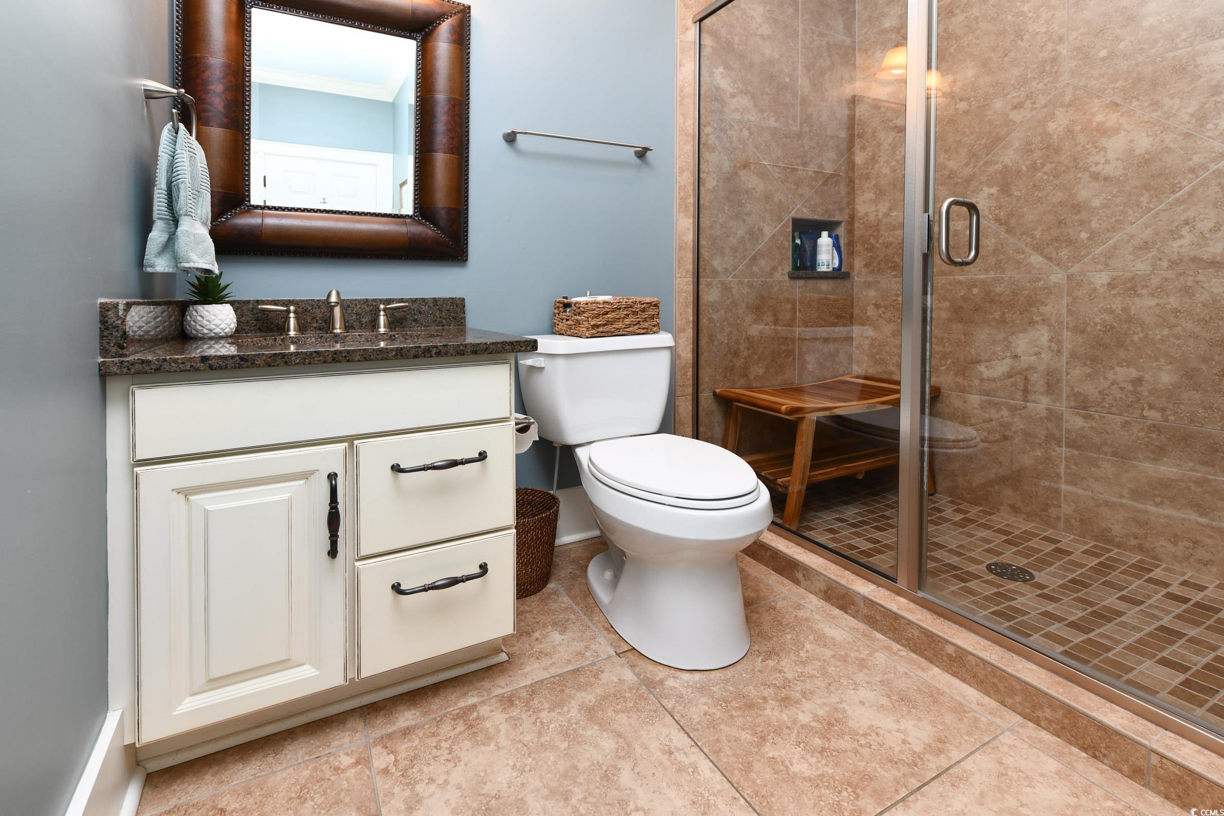 25 Orchard Avenue Murrells Inlet, SC 29576 - Photo 30 of 40 Bathroom featuring tile patterned floors, vanity,