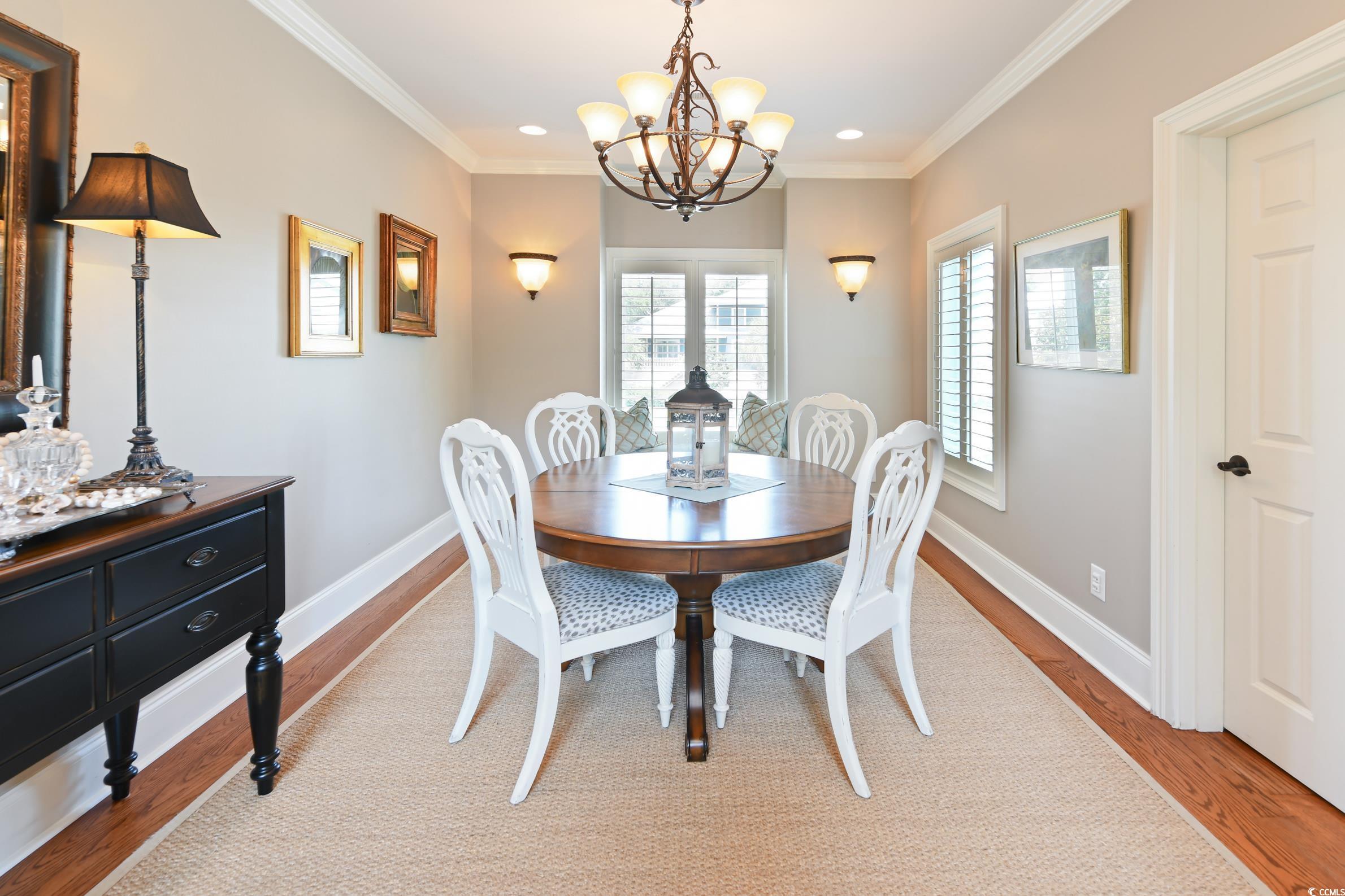 25 Orchard Avenue Murrells Inlet, SC 29576 - Photo 8 of 40 Dining room featuring ornamental molding, hardwood