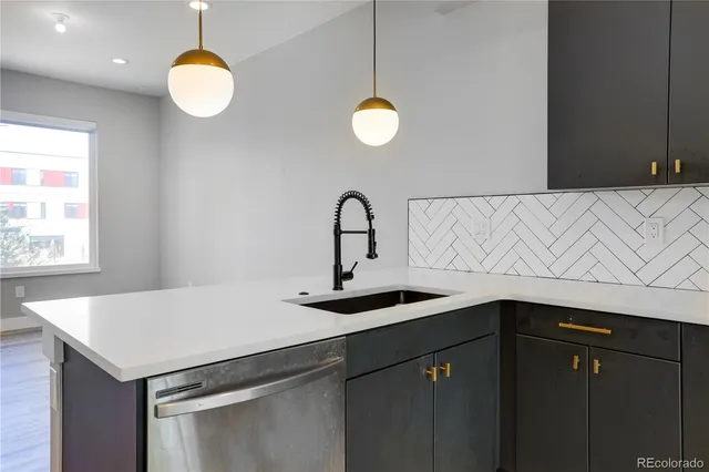 a kitchen with a sink cabinets and window