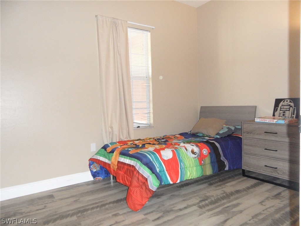 5430 Park Road, Unit 2 Fort Myers, FL 33908 - Photo 12 of 17 a bedroom with a bed and a window