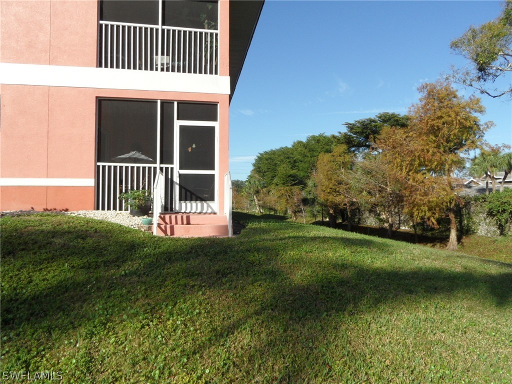 5430 Park Road, Unit 2 Fort Myers, FL 33908 - Photo 3 of 17 a front view of a house with garden