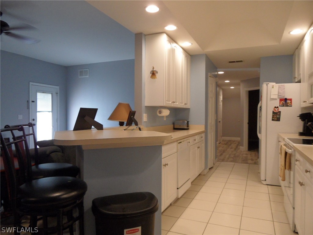 5430 Park Road, Unit 2 Fort Myers, FL 33908 - Photo 5 of 17 a spacious bathroom with a double vanity sink and a toilet