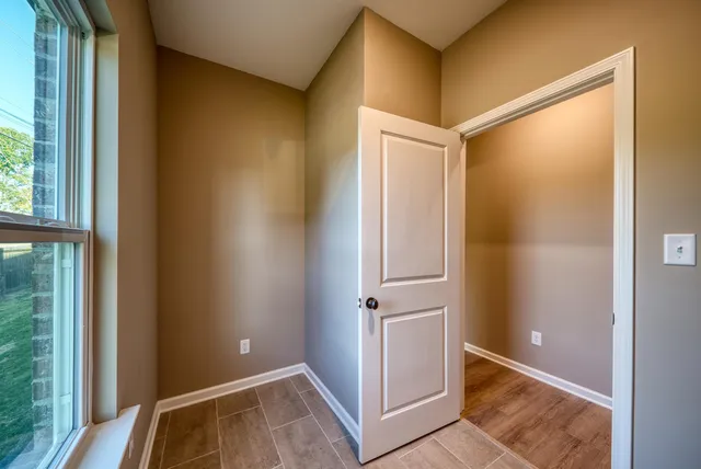 a kitchen with kitchen island granite countertop a sink stainless steel appliances and cabinets