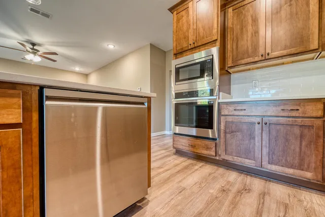 a view of an entryway with wooden floor