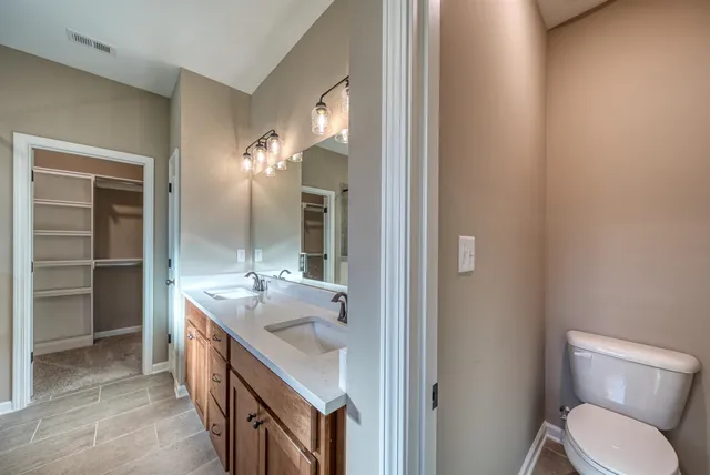 a bathroom with a shower and a sink