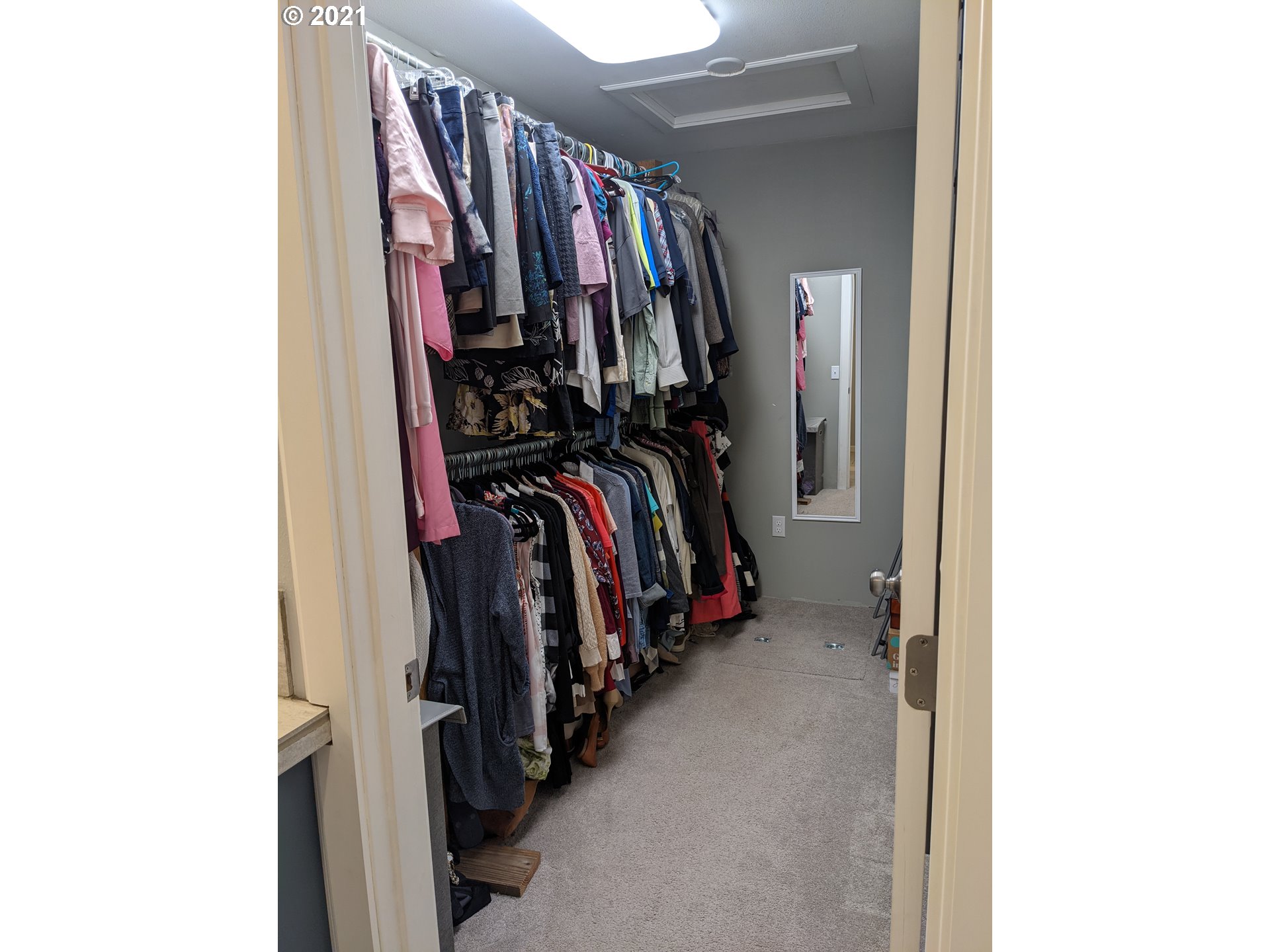 27225 Dave Road Canby, OR 97013 - Photo 15 of 31 a view of walk in closet with clothes and shoes
