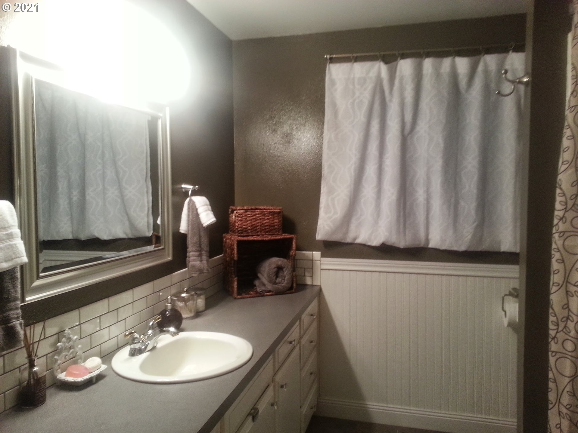 27225 Dave Road Canby, OR 97013 - Photo 20 of 31 a bathroom with a sink a toilet and a mirror
