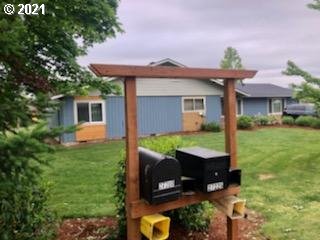 27225 Dave Road Canby, OR 97013 - Photo 25 of 31 a front view of a house with garden