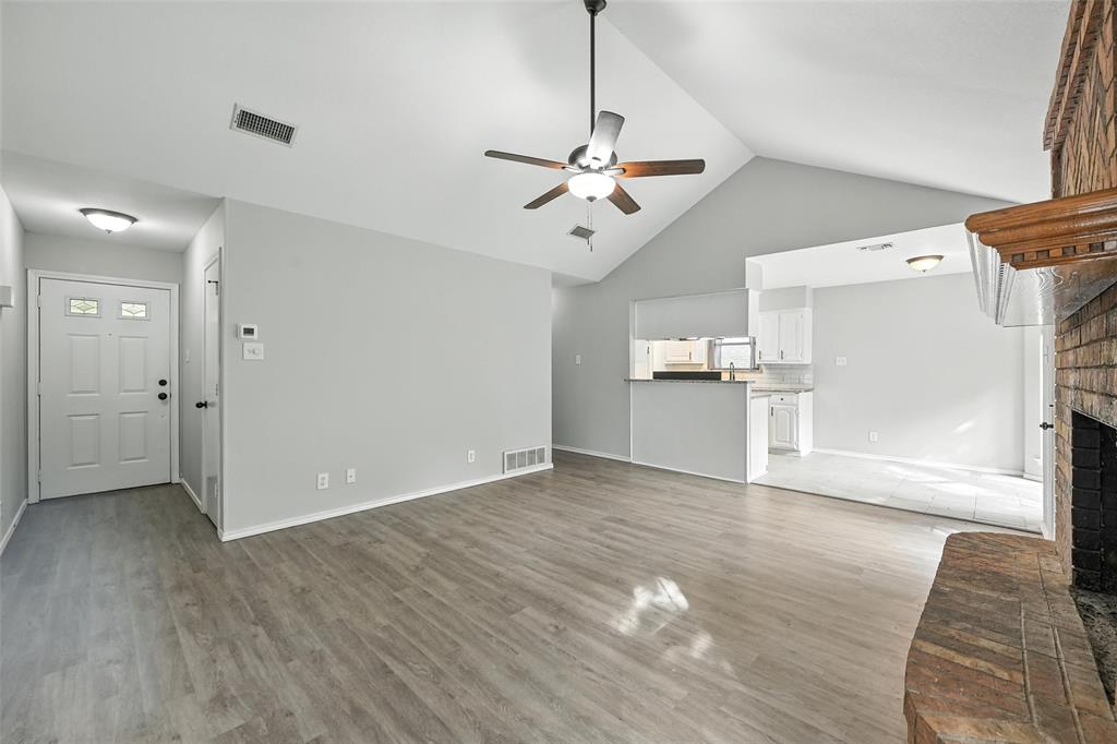 602 Valleyridge Court Decatur, TX 76234 - Photo 7 of 27 a view of empty room with wooden floor and ceiling fan