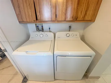 a kitchen with stainless steel appliances granite countertop a refrigerator and a stove
