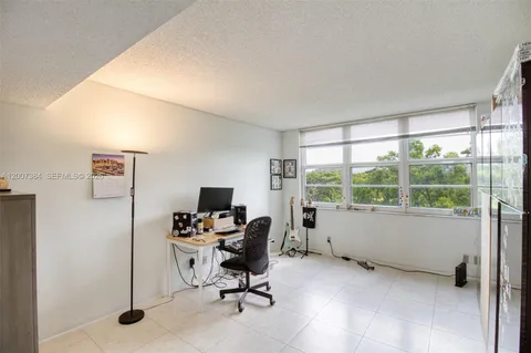 a workspace with furniture and window