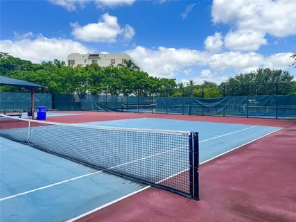 a view of an outdoor space and tennis court