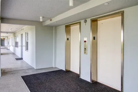 a view of a hallway with closet area
