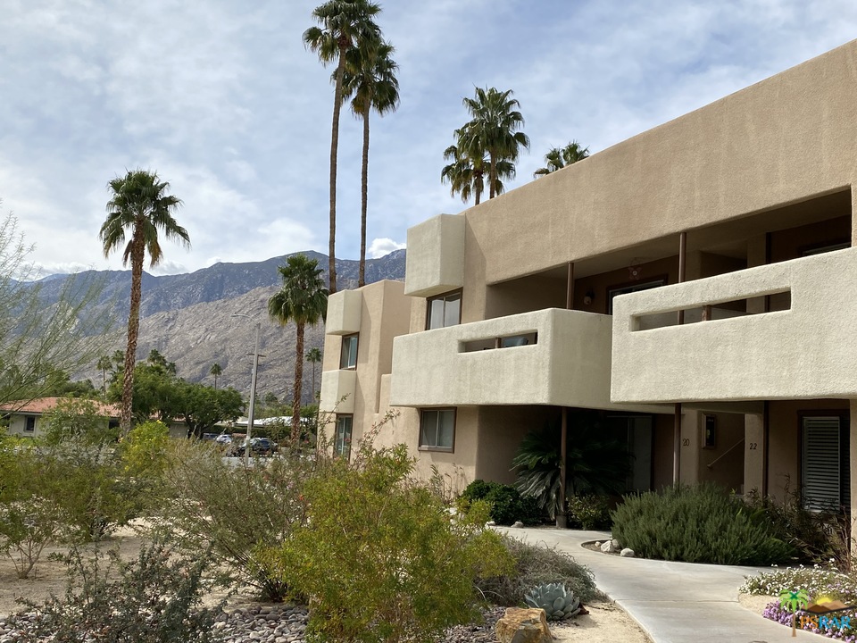 1268 Ramon Road, Unit 22 Palm Springs, CA 92264 - Photo 21 of 21 a front view of a building with a garden