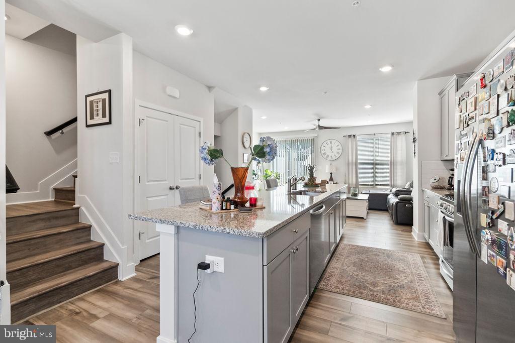 6882 Barrowfield Place Bryans Road, MD 20616 - Photo 11 of 34 a kitchen with counter top space sink stove and refrigerator