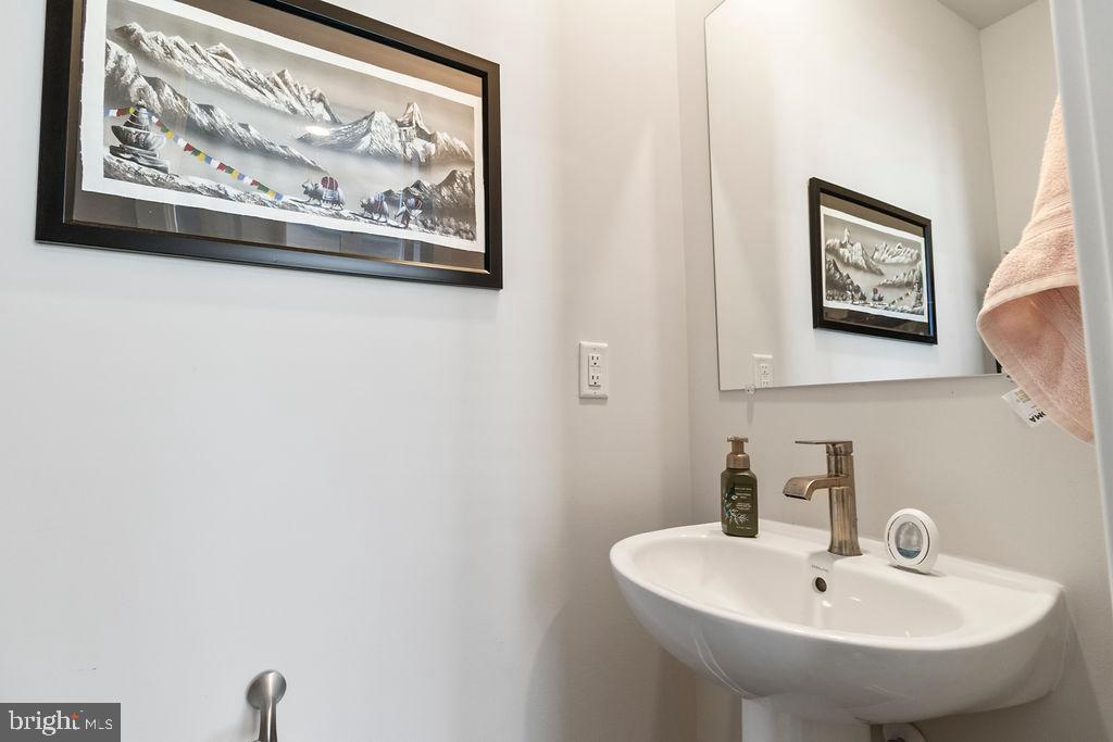 6882 Barrowfield Place Bryans Road, MD 20616 - Photo 13 of 34 a bathroom with a sink and a mirror