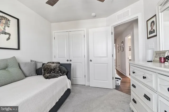 a bedroom with a bed and a cabinets