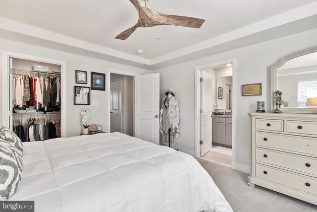 a bedroom with a bed and a mirror