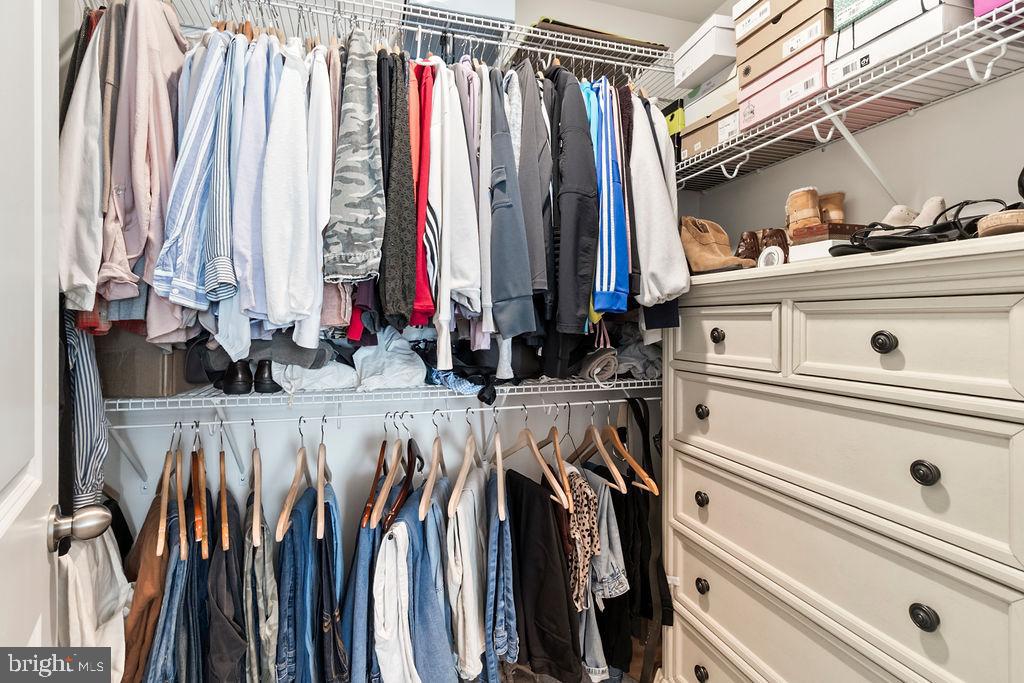 6882 Barrowfield Place Bryans Road, MD 20616 - Photo 24 of 34 a view of walk in closet with clothes and shoes