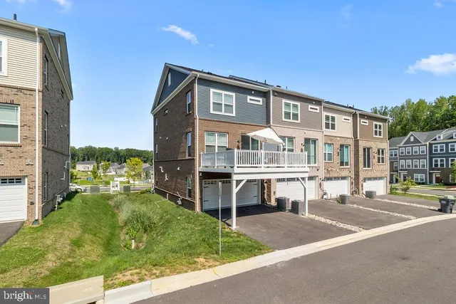 a front view of a building with a garden