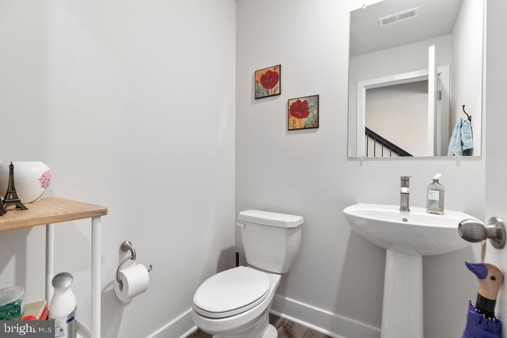 6882 Barrowfield Place Bryans Road, MD 20616 - Photo 5 of 34 a bathroom with a toilet sink and mirror