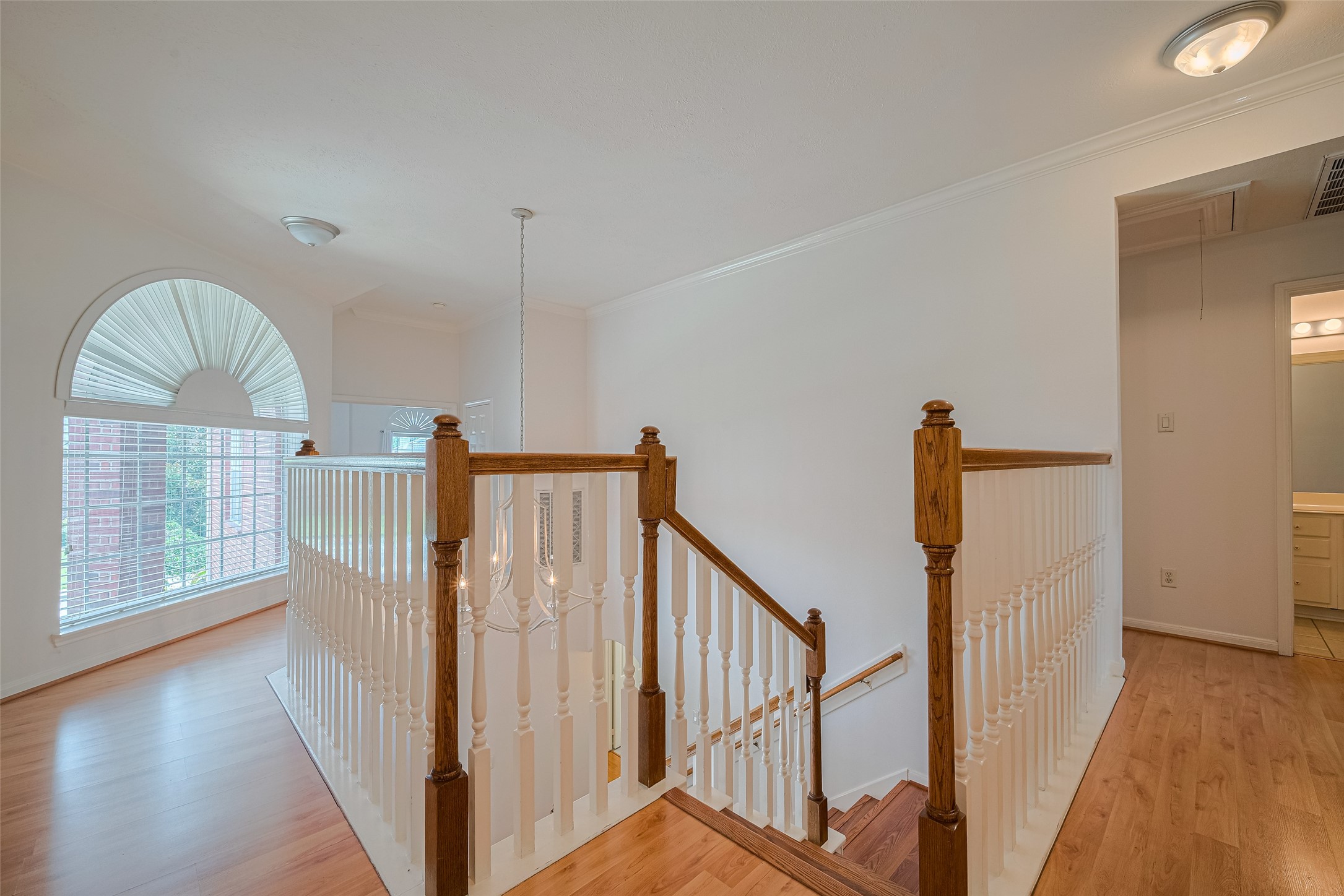 9218 Memorial Pines Way Spring, TX 77379 - Photo 20 of 39 Plenty of natural light illuminate the open staircase offering a welcoming and airy feel.