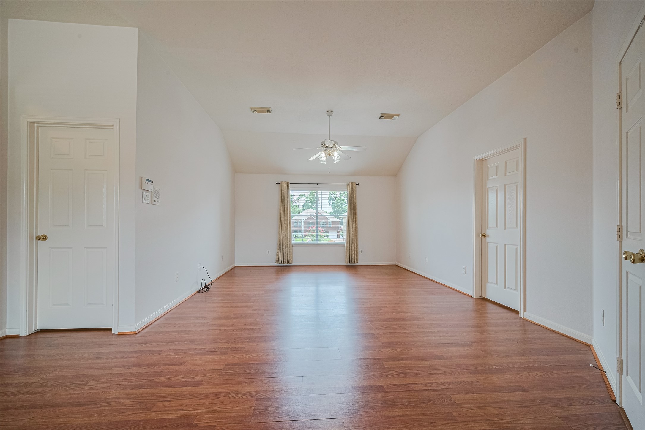 9218 Memorial Pines Way Spring, TX 77379 - Photo 24 of 39 Spacious primary bedroom with room for a cozy sitting area or nursery.