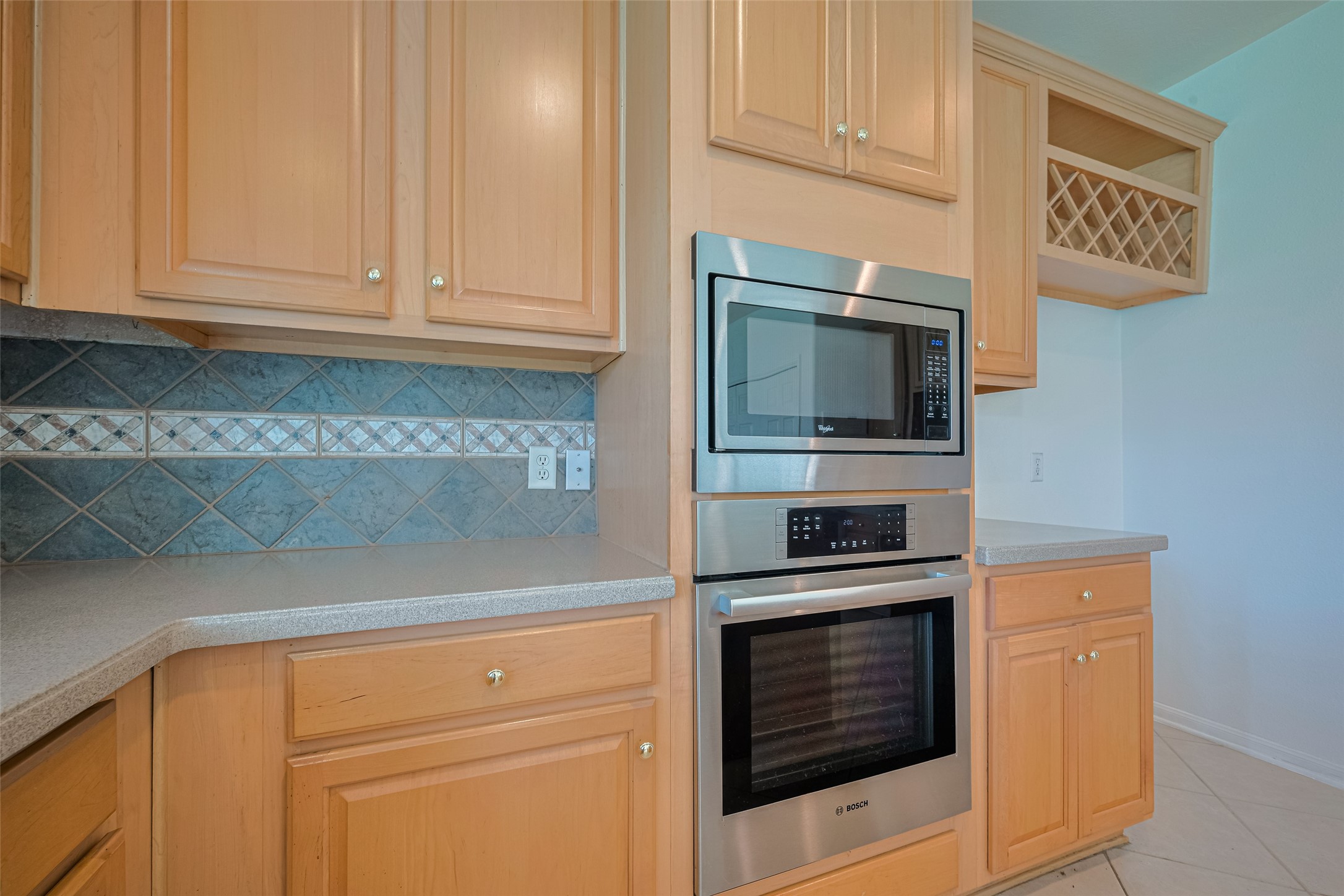 9218 Memorial Pines Way Spring, TX 77379 - Photo 7 of 39 Built-in stainless steel oven and microwave for a sleek, modern kitchen.
