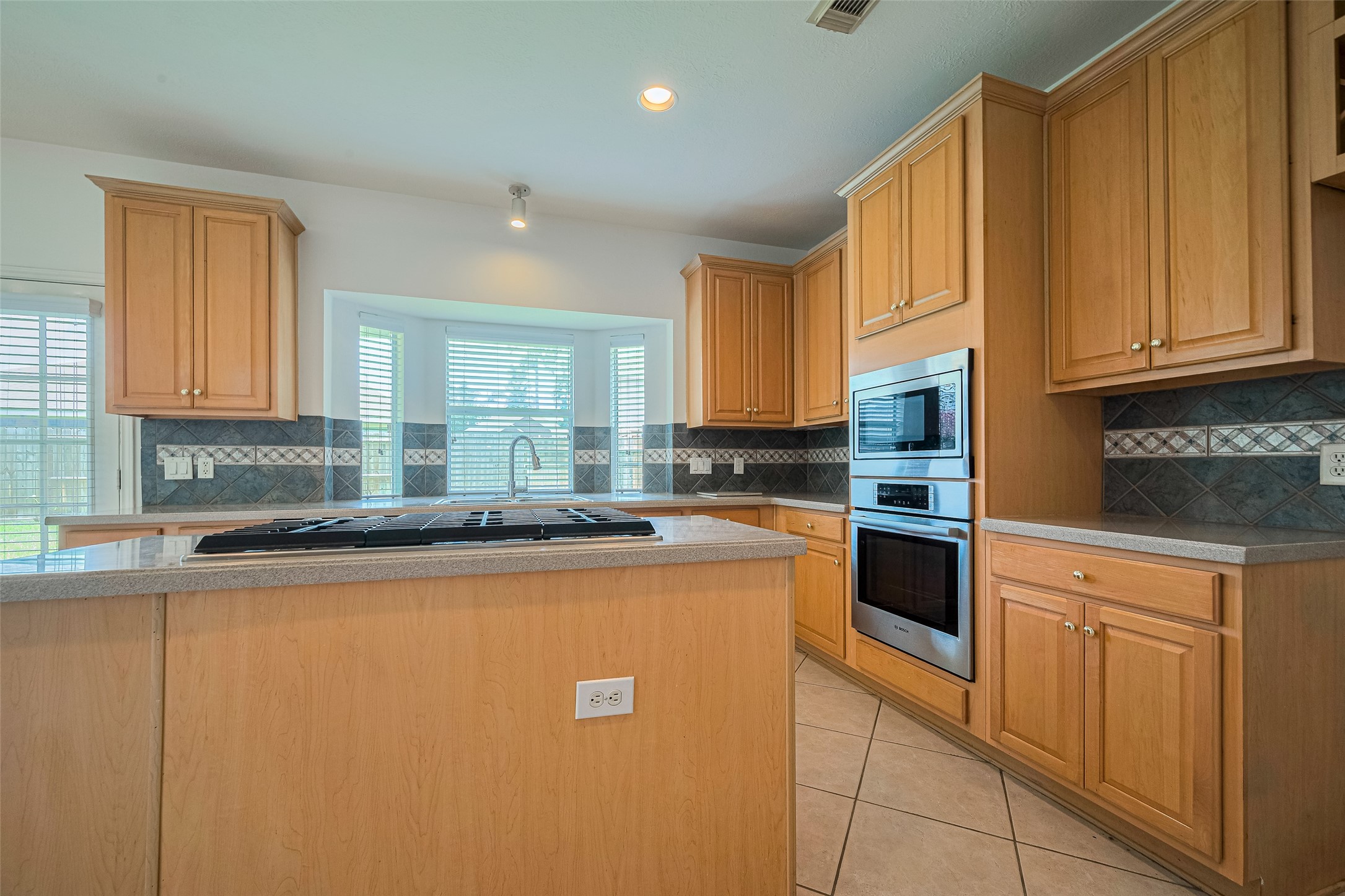 9218 Memorial Pines Way Spring, TX 77379 - Photo 8 of 39 Bright, spacious kitchen with modern appliances and ample cabinetry.