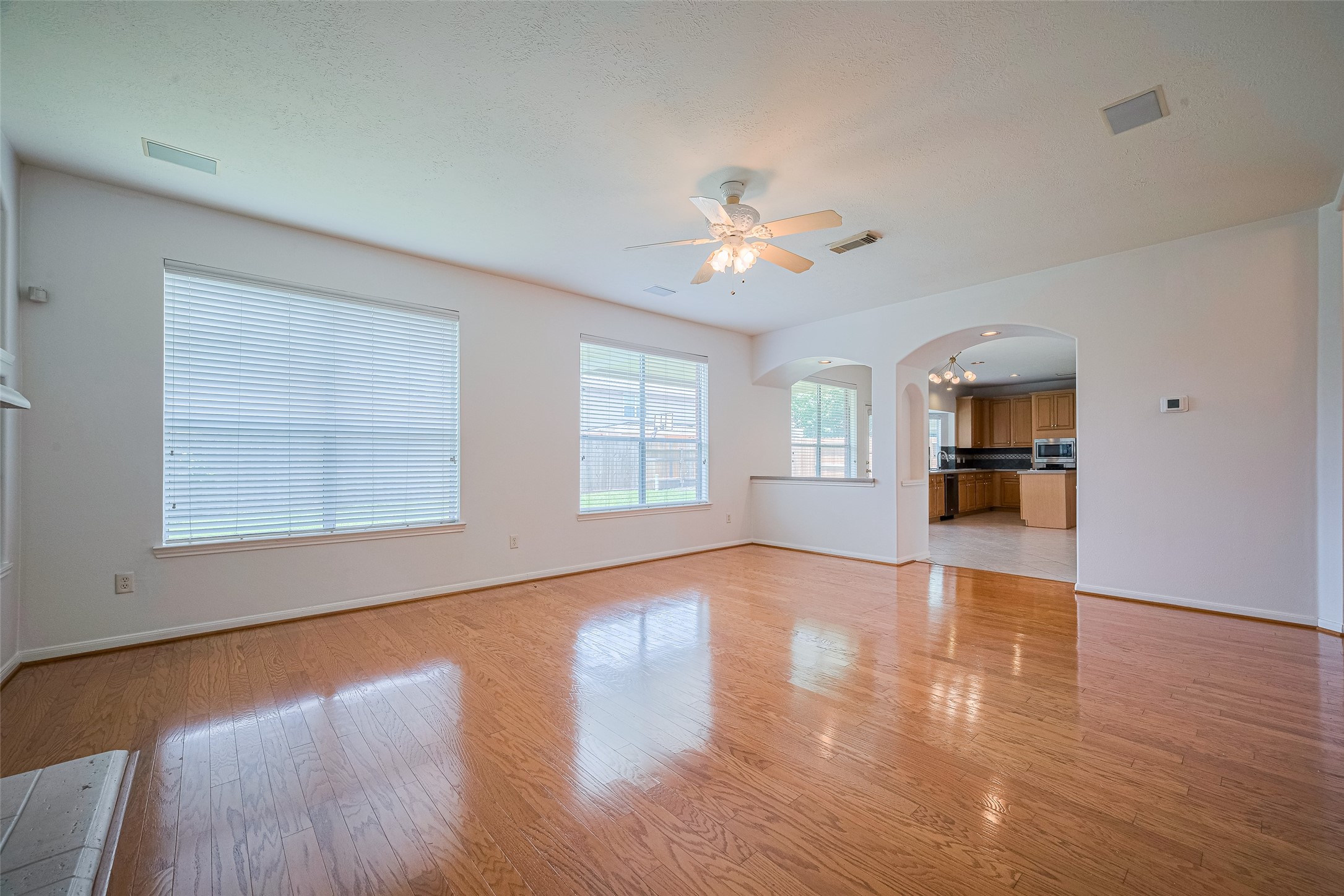 9218 Memorial Pines Way Spring, TX 77379 - Photo 9 of 39 Enjoy seamless flow from the kitchen and breakfast area to the inviting family room.