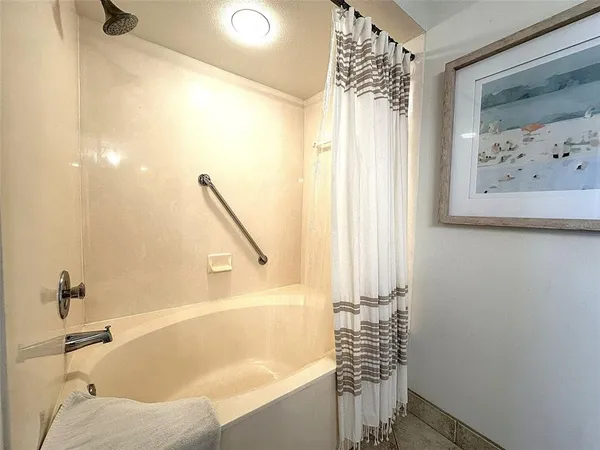 a bathroom with a sink and shower