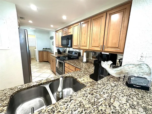 a view of a dining hall with a dining table and chairs