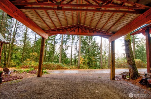 a backyard of a house with a large tree