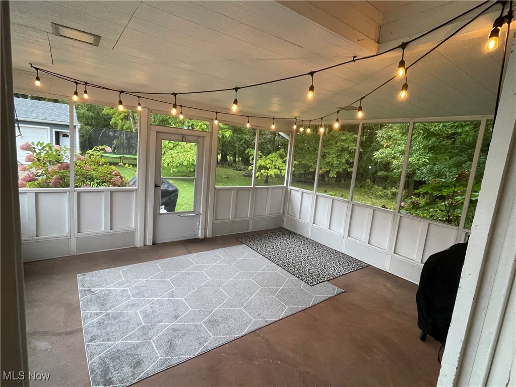 1796 Lander Road Mayfield Heights, OH 44124 - Photo 5 of 39 Unfurnished sunroom with rail lighting