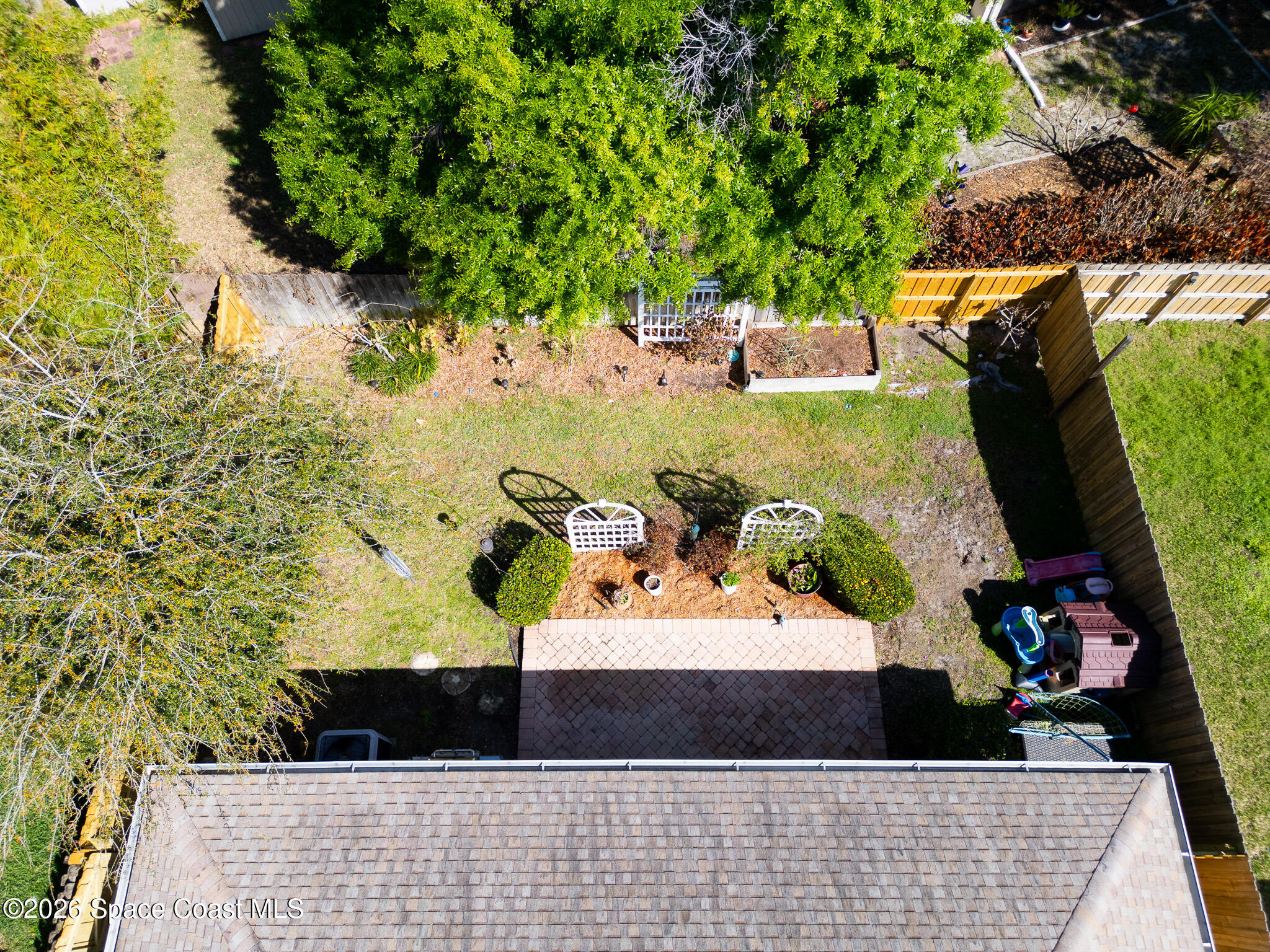 4720 Decatur Circle Melbourne, FL 32934 - Photo 24 of 25 Backyard Drone 1